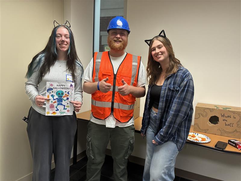 Students posing in costumes.